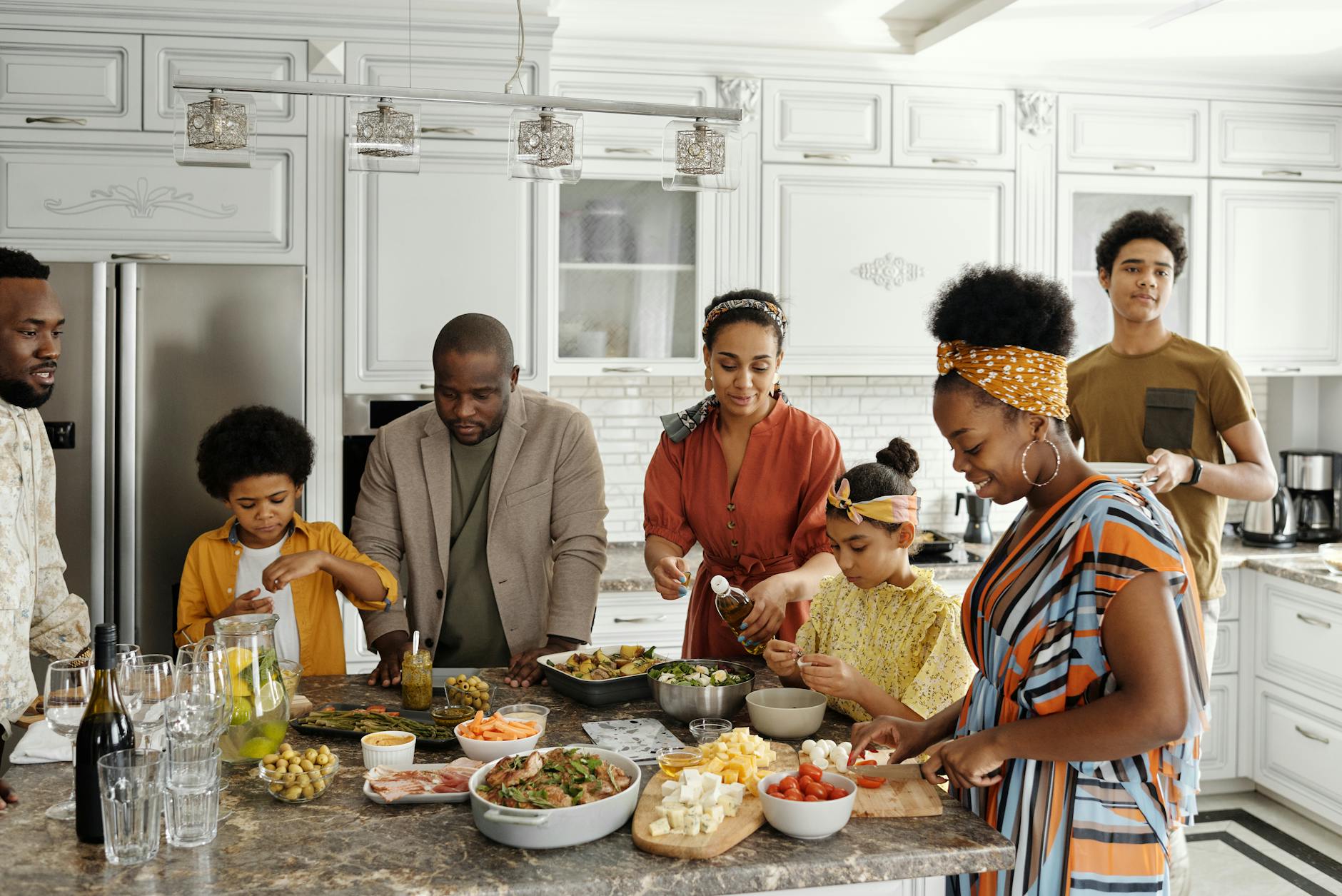 family preparing food in the kitchen, building a strong family with intentional choices