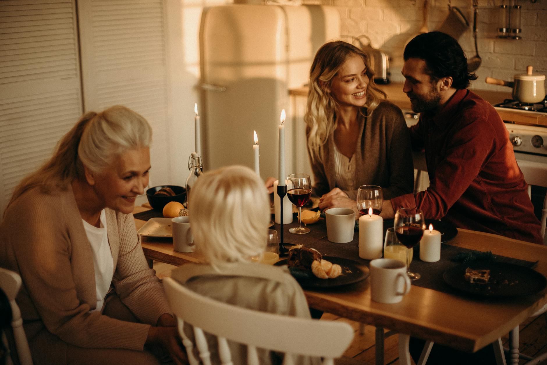 people sitting on chairs by the dining table