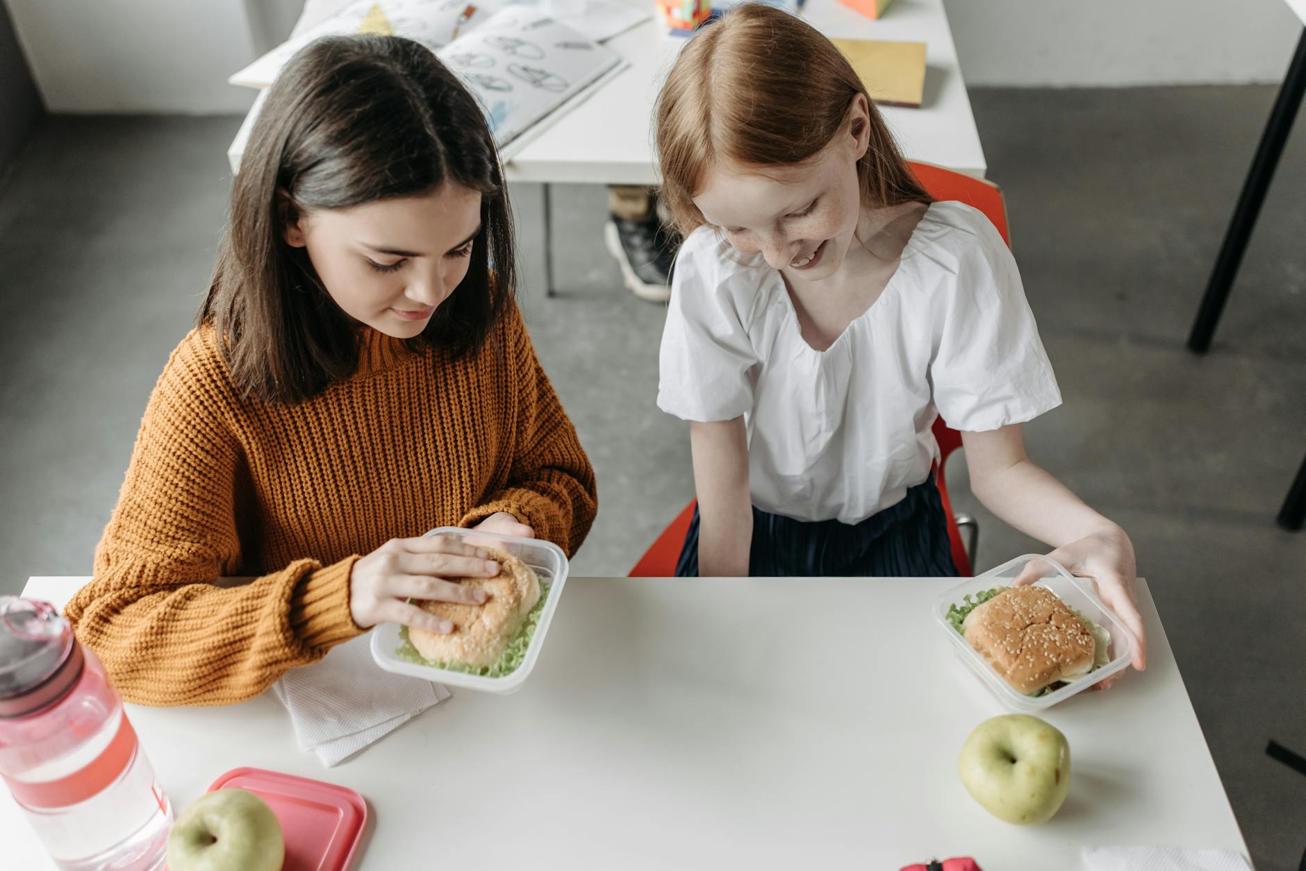 girls sitting at the table