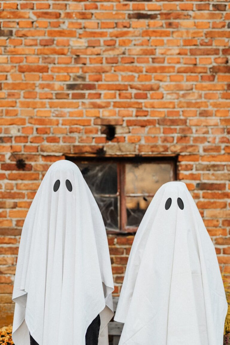 ghosts in front of a brick wall