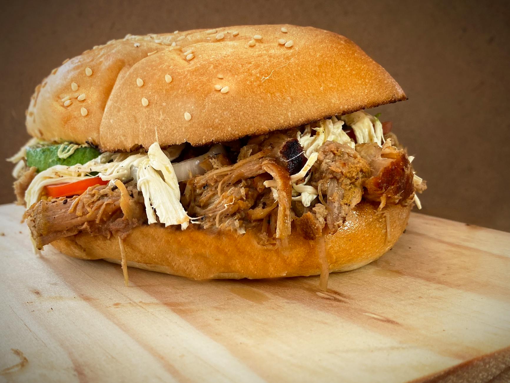 close up of a sandwich with pulled meat